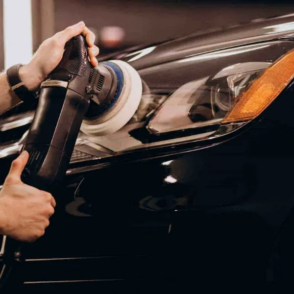 Machine polishing a car's paintwork