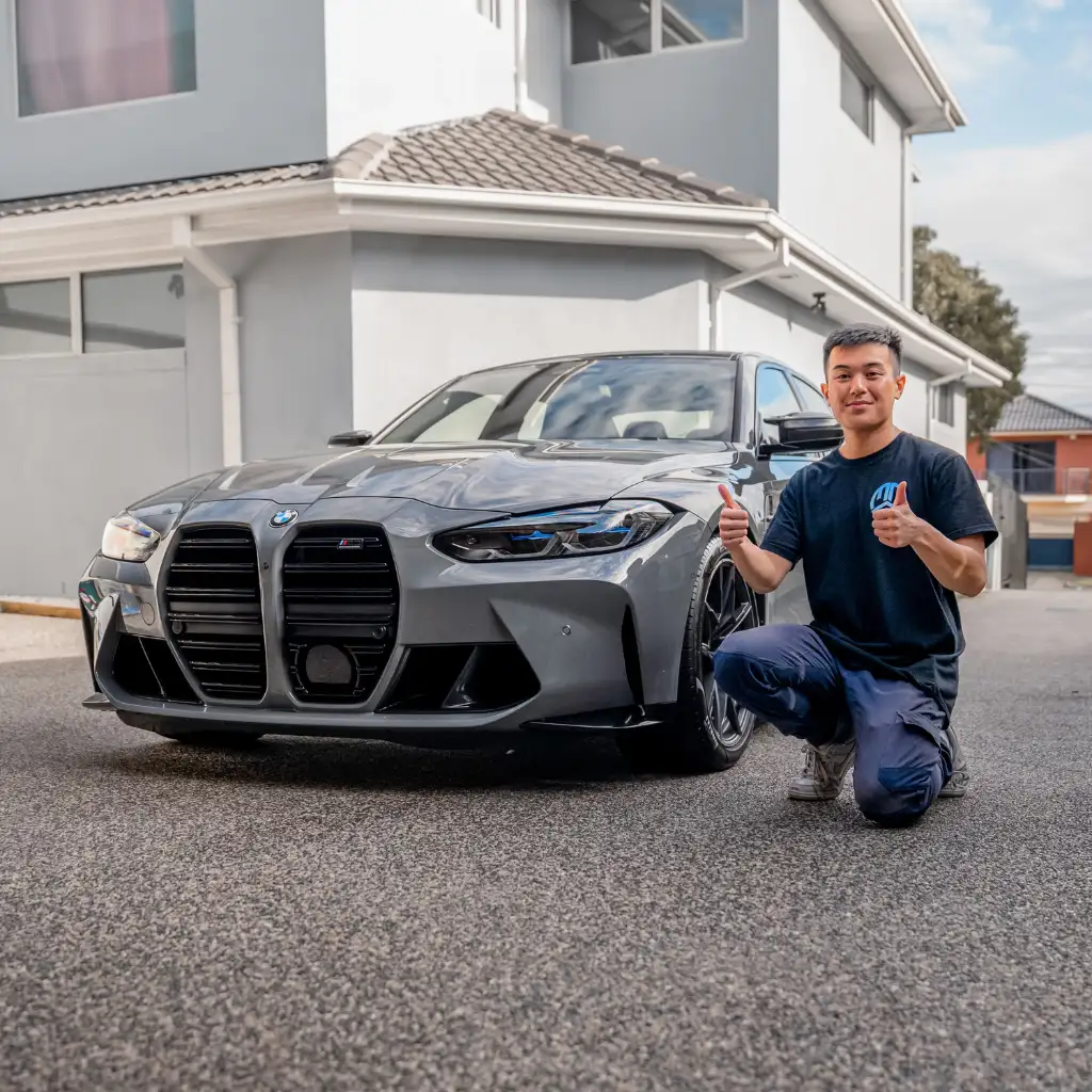 Happy client with a freshly detailed BMW M3