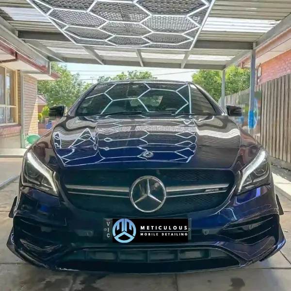 Mercedes A45 under hexagon lights at the Springvale workshop
