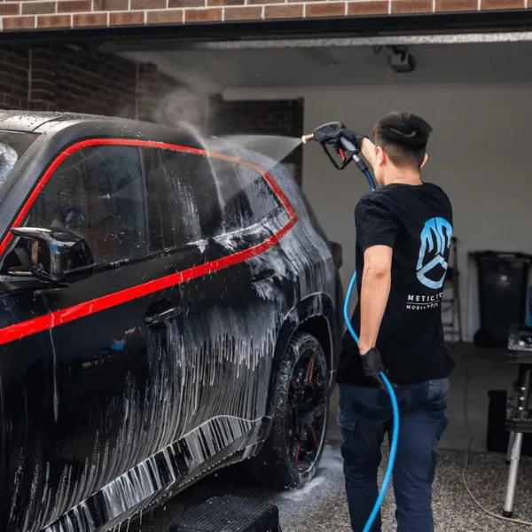 Snow foam pre-wash on a black car